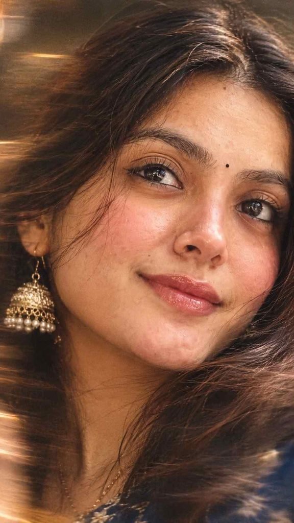 Extreme macro woman portrait with warm lighting and gold jhumka